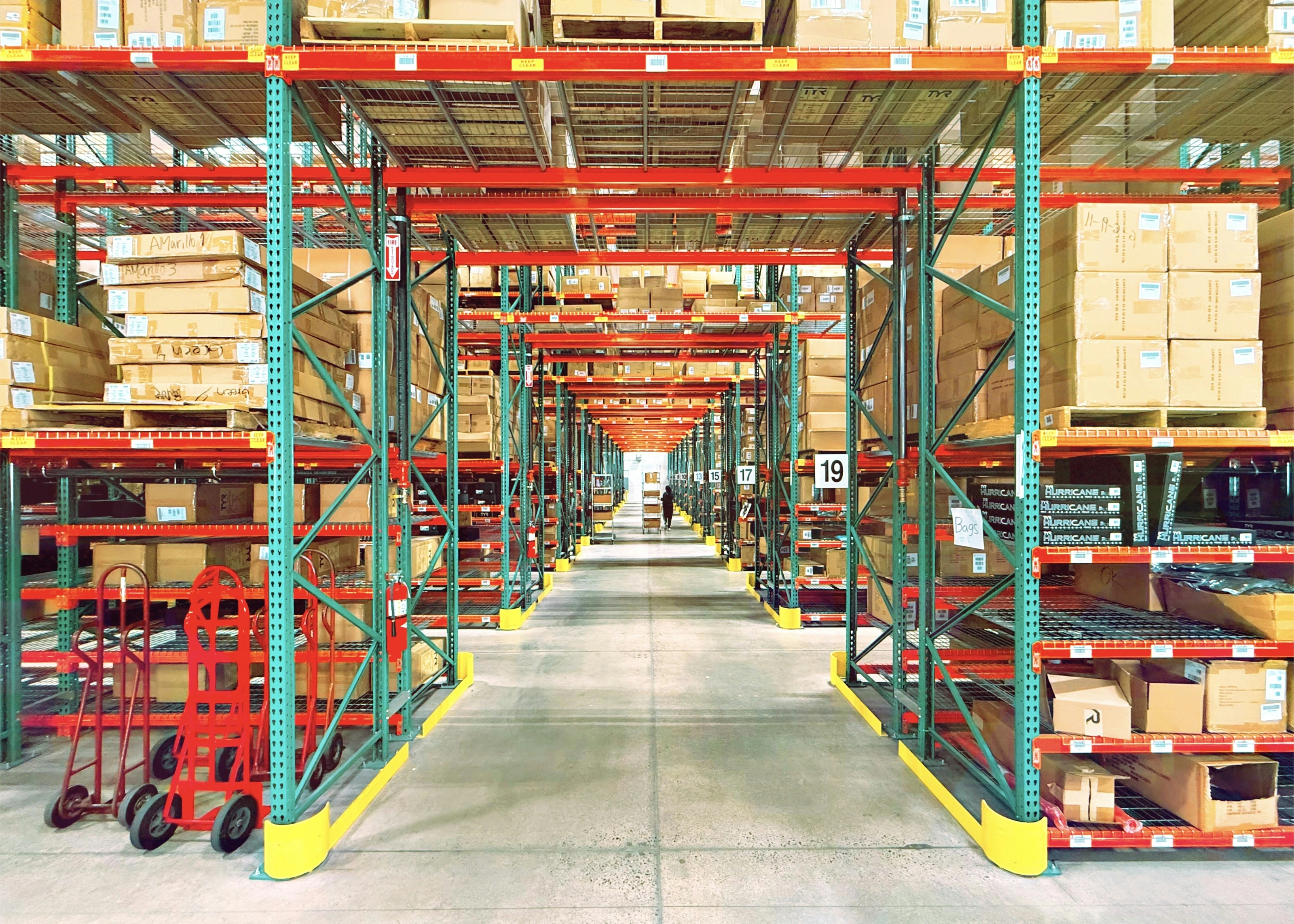 Warehouse aisle with storage racks and inventory